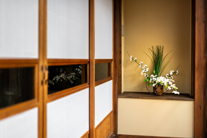 Traditional japanese house with shoji sliding paper doors and ikebana decoration